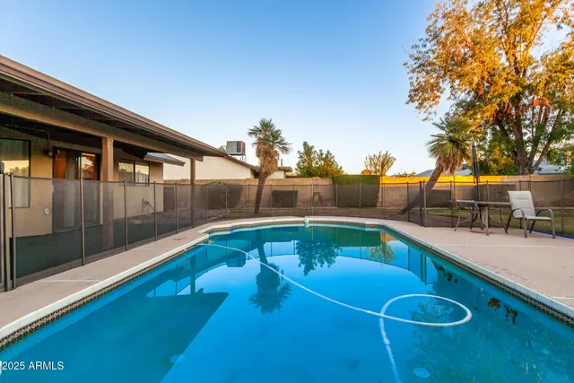 a view of a swimming pool with a patio