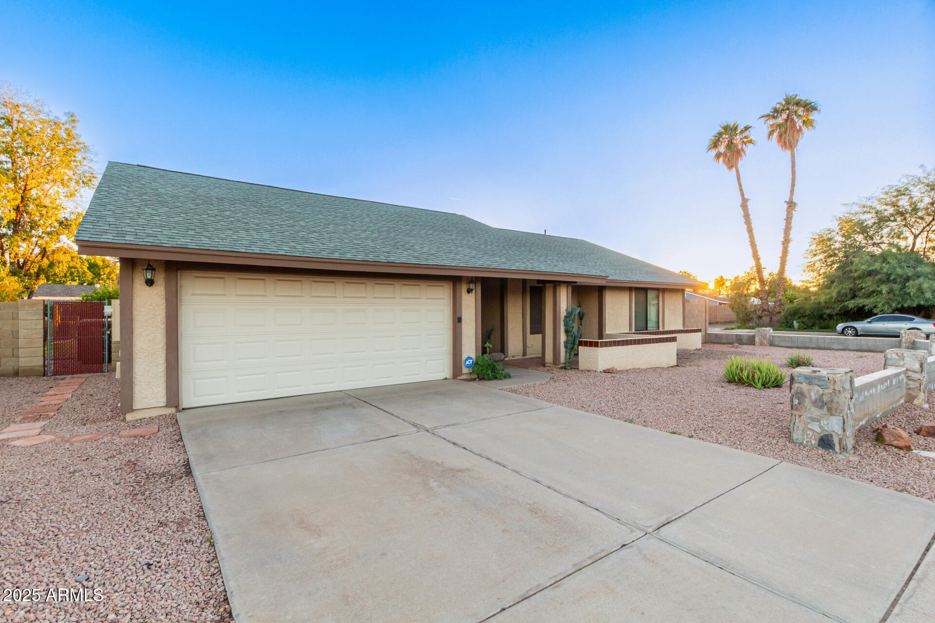 1729 West Brooks Street Chandler, AZ 85224 - Photo 3 of 33 a front view of a house with a yard and garage