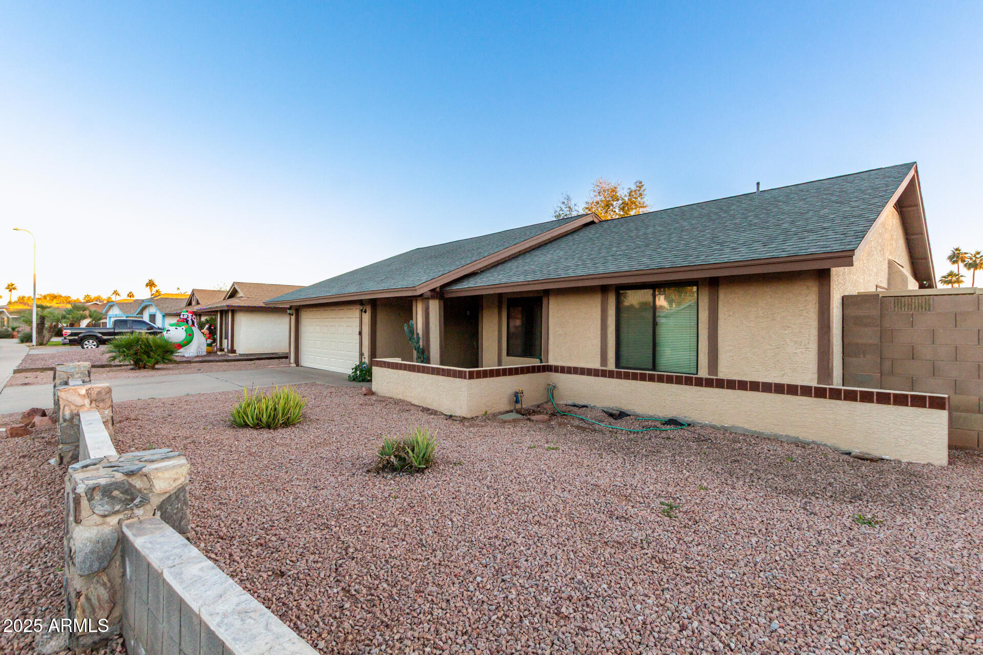 1729 West Brooks Street Chandler, AZ 85224 - Photo 5 of 33 a front view of a house with garden