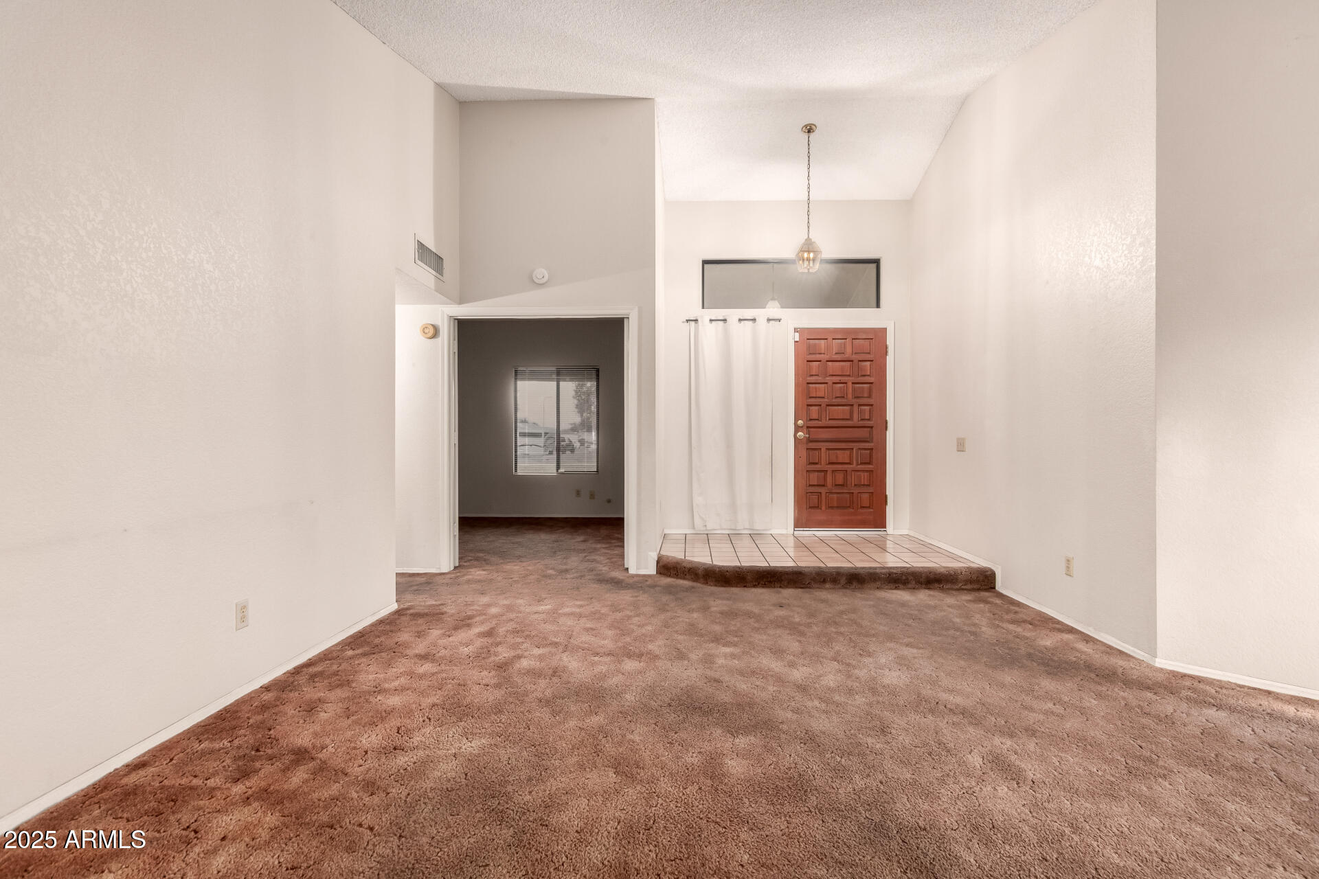 1729 West Brooks Street Chandler, AZ 85224 - Photo 7 of 33 a view of a room with an empty space and window