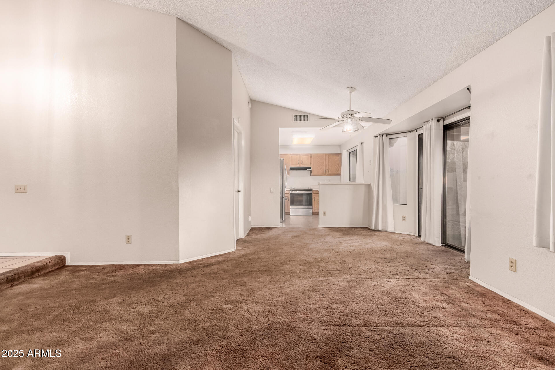 1729 West Brooks Street Chandler, AZ 85224 - Photo 8 of 33 a view of a kitchen with a sink and a refrigerator