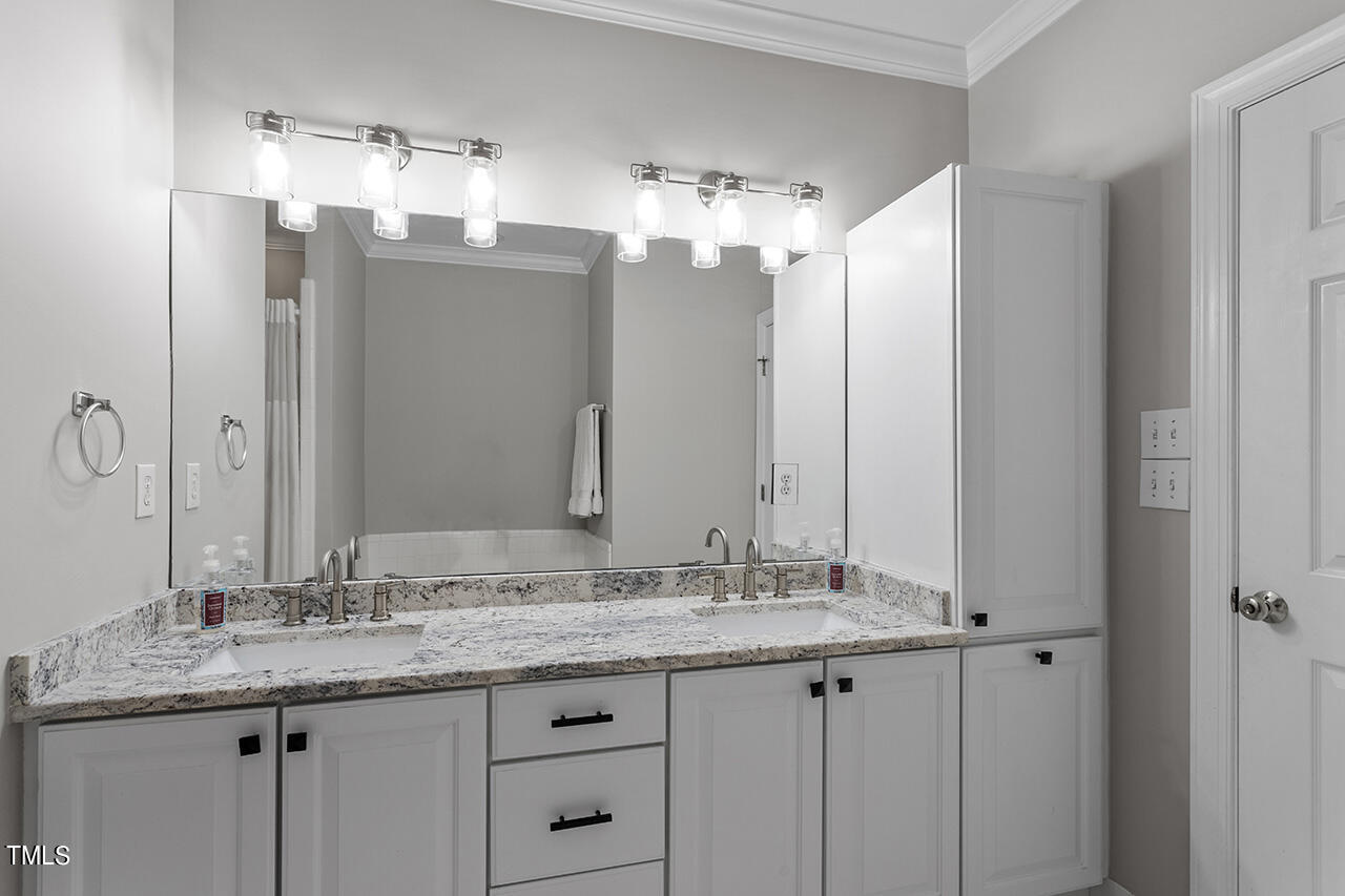200 South Dawson Street, Unit 203 Raleigh, NC 27601 - Photo 23 of 35 Primary bathroom features double vanities, shower & soaking bathtub.