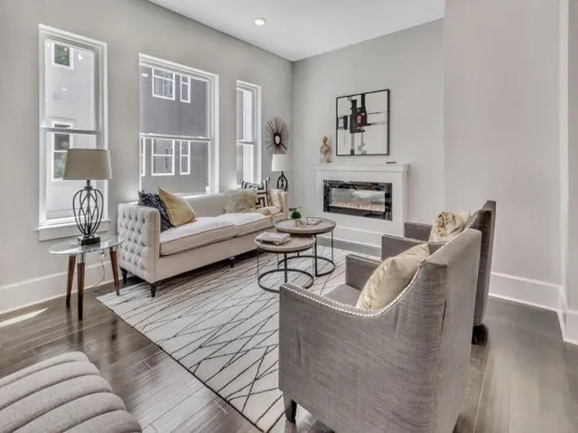 a living room with furniture and a fireplace