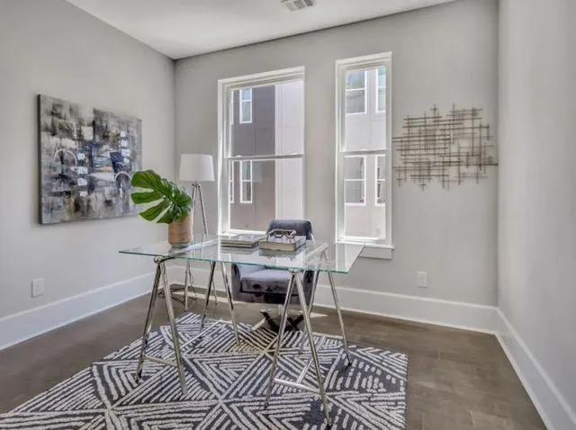 a workspace with furniture and window