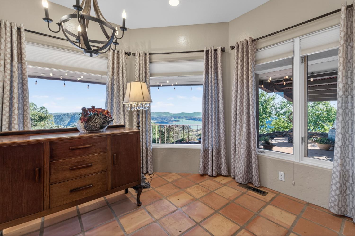 7570 Airola Road Vallecito, CA 95251 - Photo 32 of 90 a bedroom with a large bed and a window