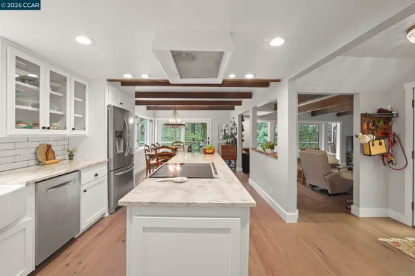 a view of living room with furniture and large windows