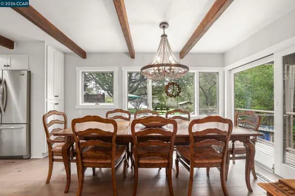 a view of a dining room with furniture window and outside view