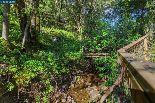 a view of balcony with lots of trees