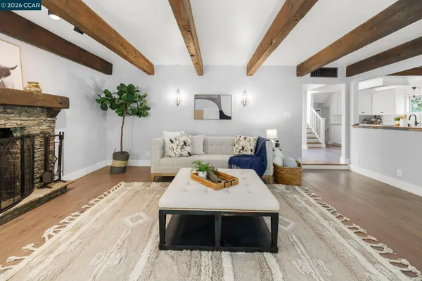 a view of a livingroom with furniture and a fireplace