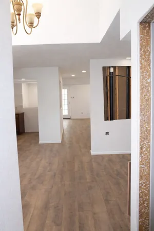 a view of a hallway with an empty room