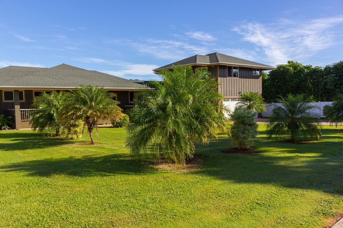 3746 Omao Road Koloa, HI 96756 - Photo 1 of 25 a front view of a house with a yard