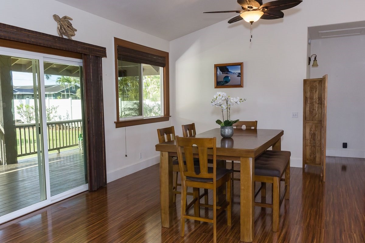 3746 Omao Road Koloa, HI 96756 - Photo 15 of 25 a view of a dining room with furniture window and wooden floor