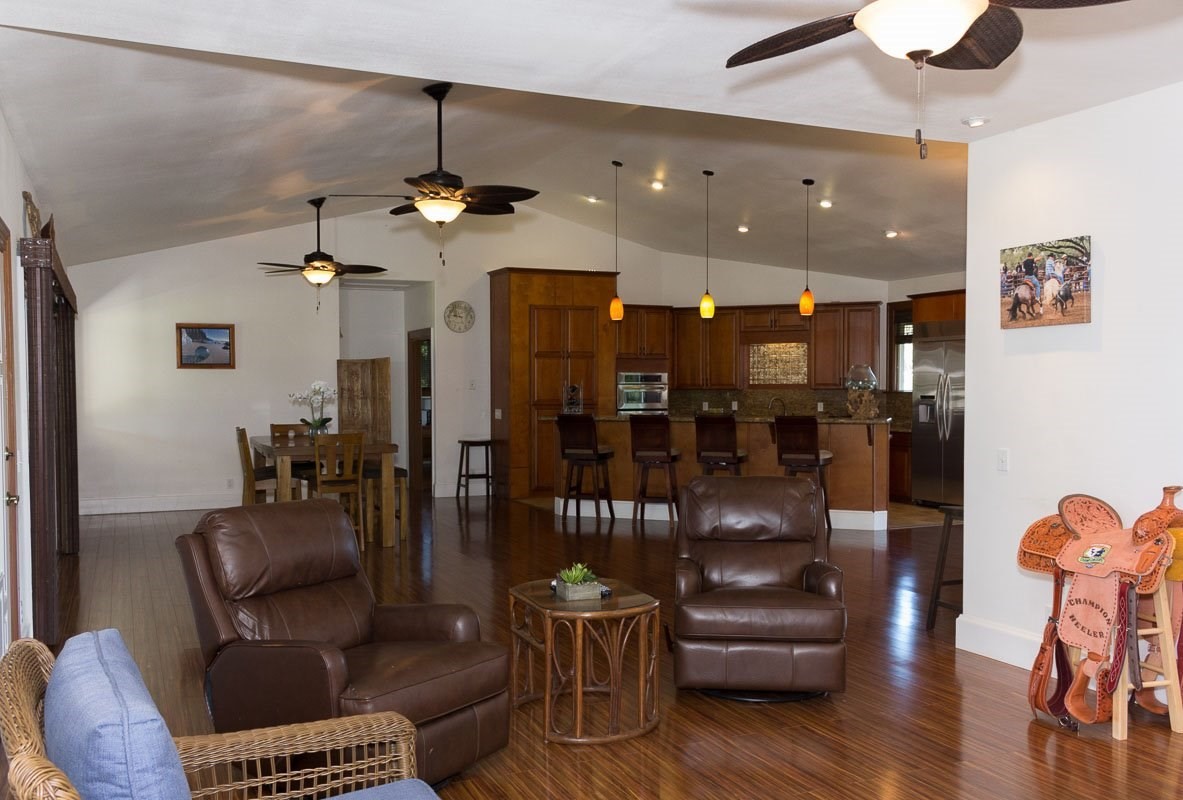 3746 Omao Road Koloa, HI 96756 - Photo 16 of 25 a living room with furniture and wooden floor