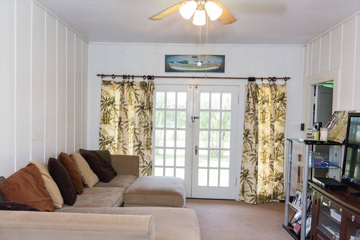 3746 Omao Road Koloa, HI 96756 - Photo 24 of 25 a living room with furniture and a flat screen tv