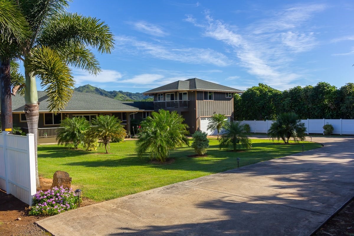 3746 Omao Road Koloa, HI 96756 - Photo 4 of 25 a front view of a house with garden