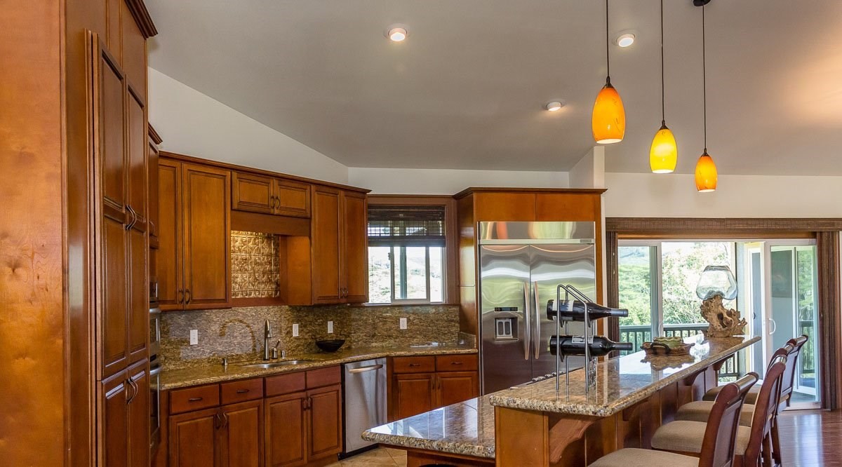 3746 Omao Road Koloa, HI 96756 - Photo 9 of 25 a kitchen with counter top space and dining table