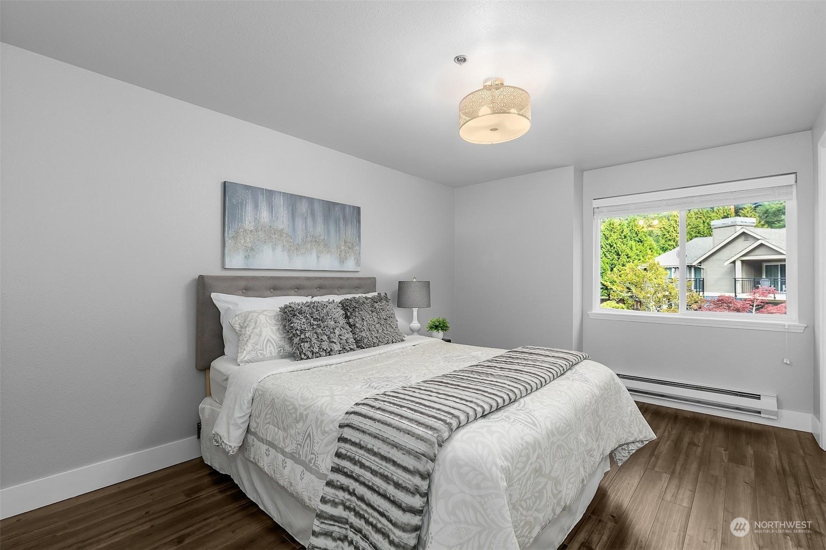 19404 Bothell Way Northeast, Unit B303 Bothell, WA 98011 - Photo 18 of 27 a bedroom with a bed and a window