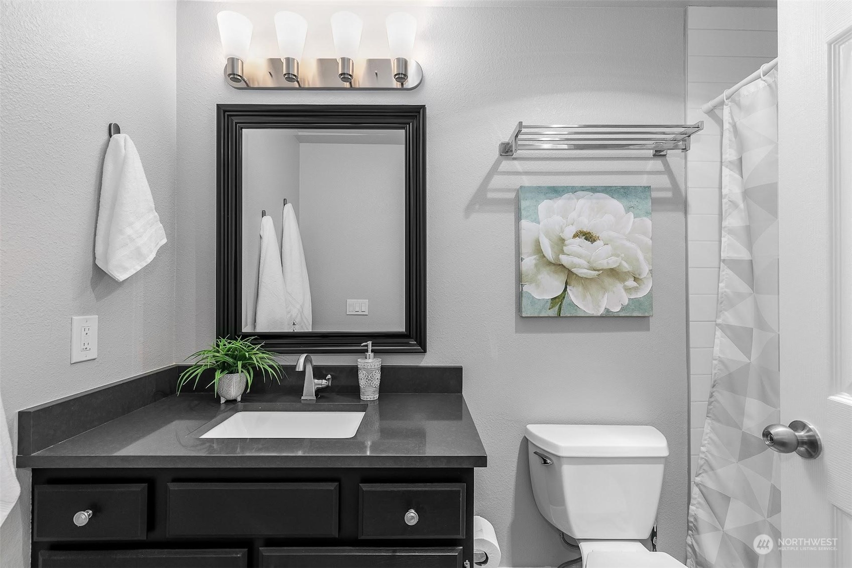19404 Bothell Way Northeast, Unit B303 Bothell, WA 98011 - Photo 19 of 27 a bathroom with a toilet a sink and mirror