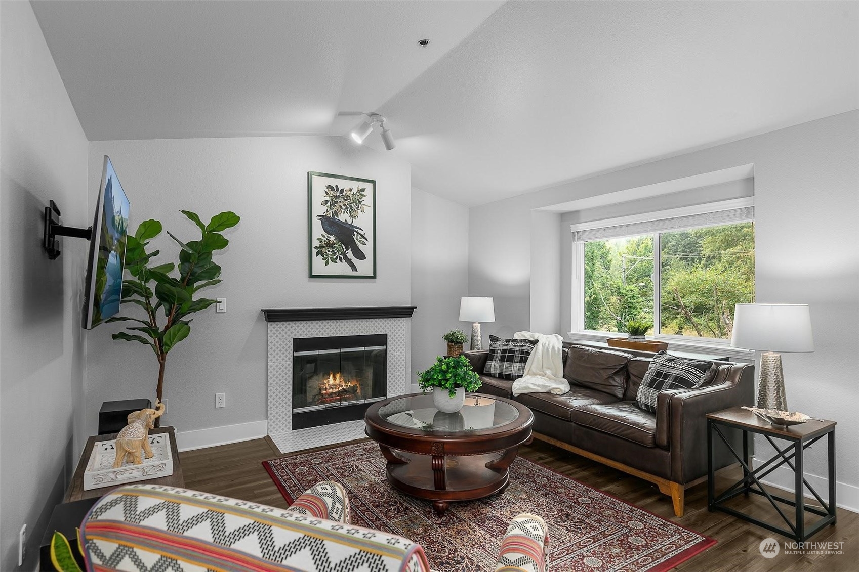 19404 Bothell Way Northeast, Unit B303 Bothell, WA 98011 - Photo 5 of 27 a living room with furniture and a fireplace