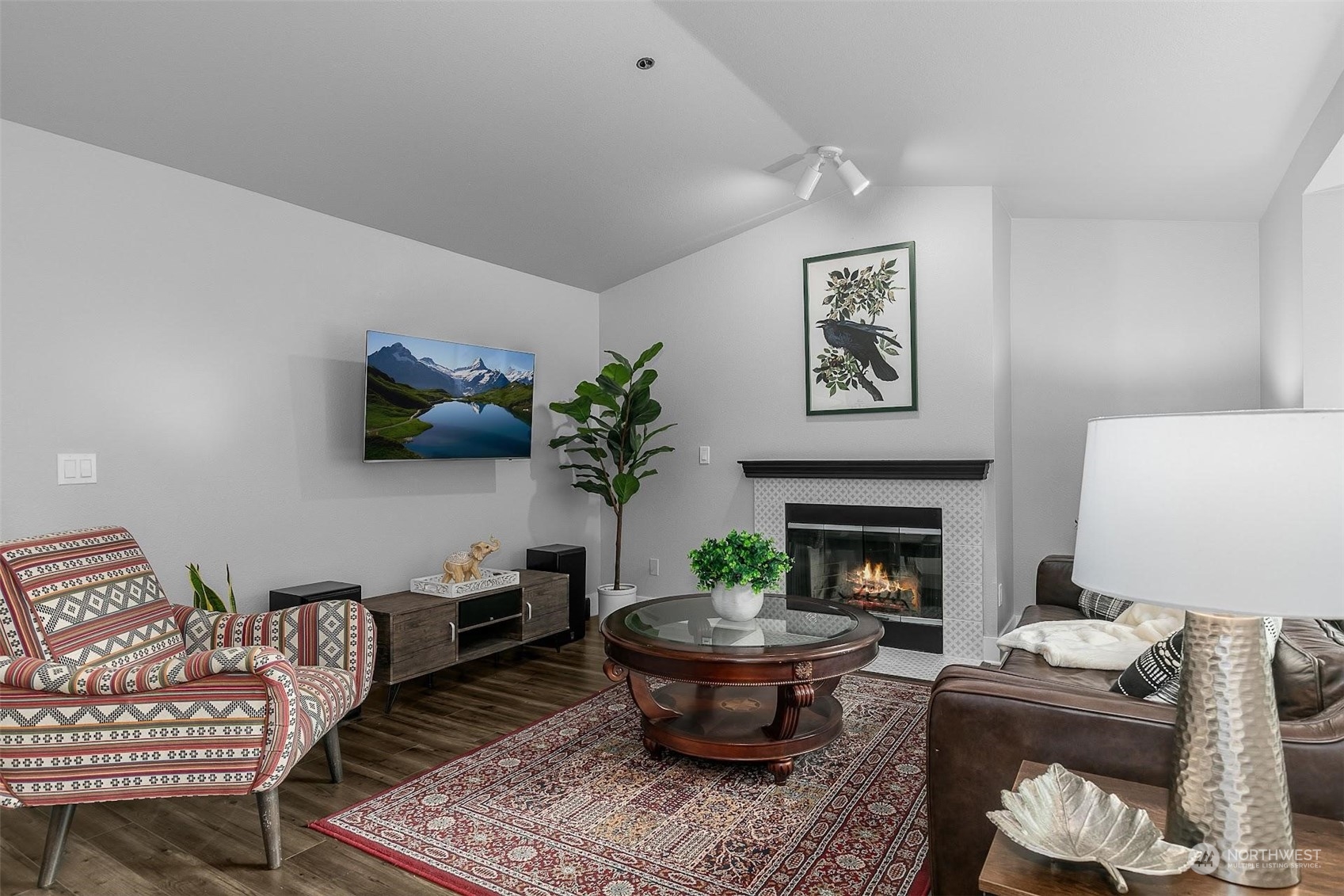 19404 Bothell Way Northeast, Unit B303 Bothell, WA 98011 - Photo 6 of 27 a living room with furniture and a fireplace