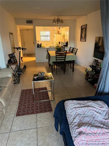 a bed room with a bed and a chair