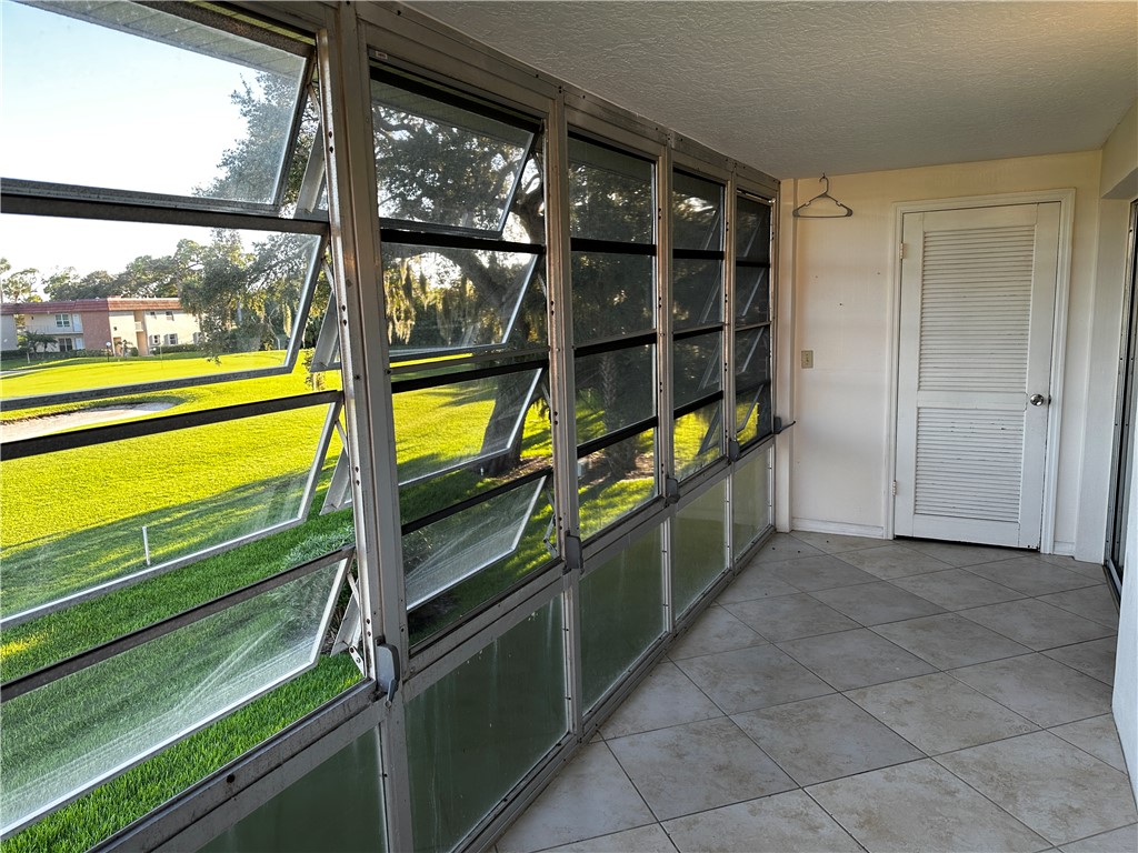 93 Spring Lake Drive, Unit 202 Vero Beach, FL 32962 - Photo 15 of 18 a kitchen with a large window