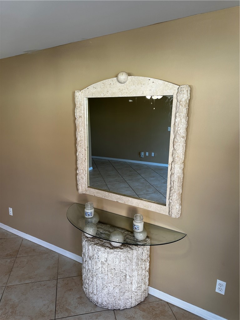 93 Spring Lake Drive, Unit 202 Vero Beach, FL 32962 - Photo 6 of 18 a living room with a fireplace