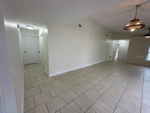 a view of a hallway with a window