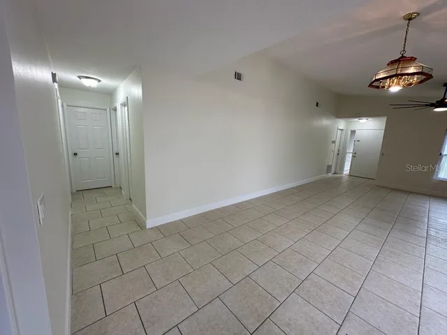 a view of a hallway with a window