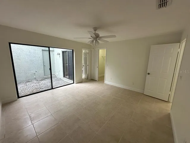 a view of an empty room with a window