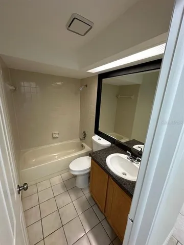 a bathroom with a toilet a sink and bathtub