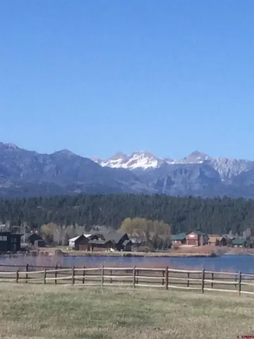 a view of house with mountains in the background