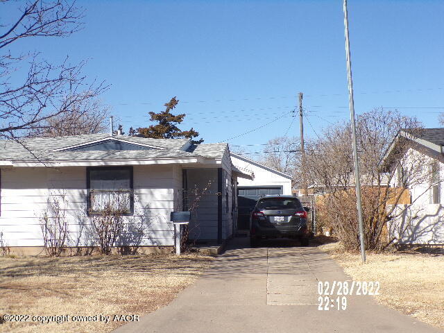 3810 Gables Street Amarillo, TX 79110 - Photo 2 of 3 a front view of a house with a yard