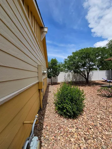 a view of a garden with wooden stairs