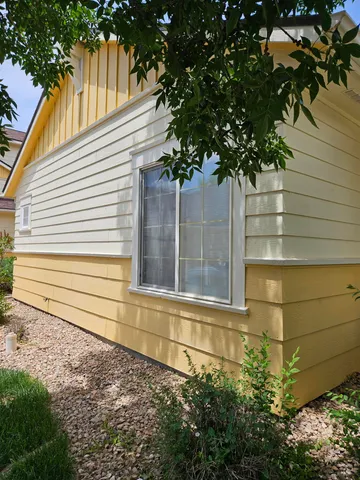 a small white house with a outdoor space