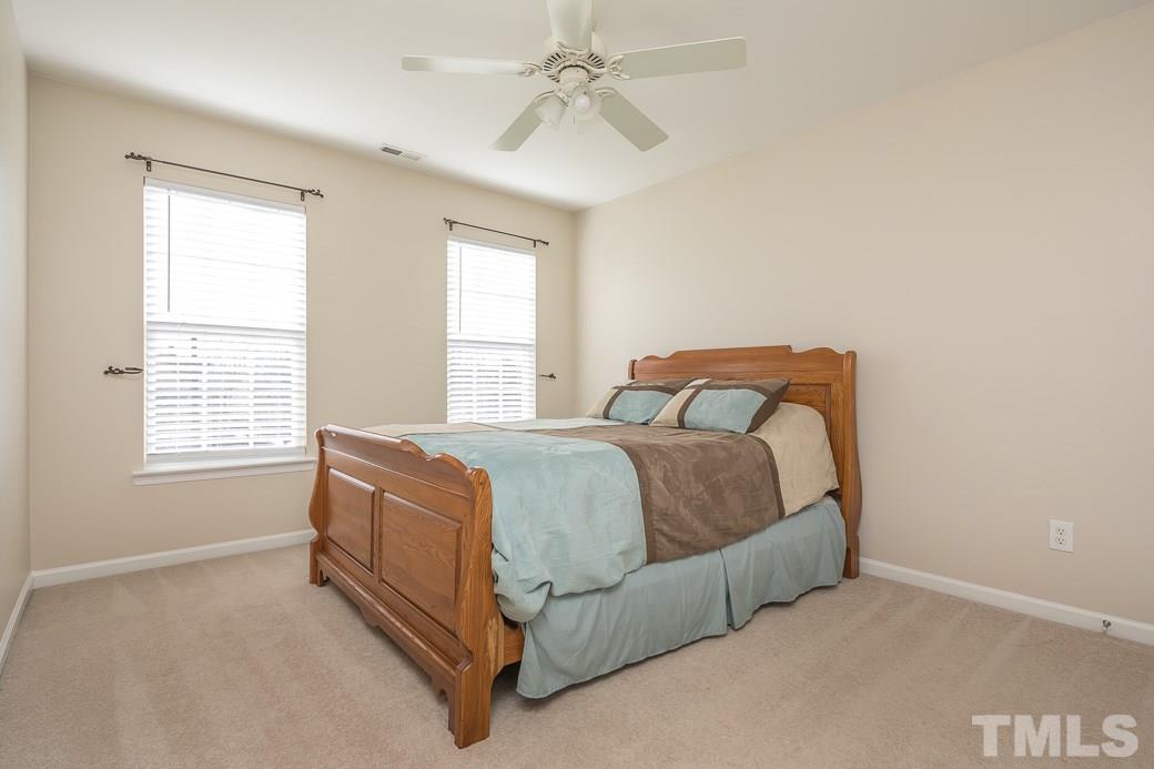 3315 Colorcott Street Raleigh, NC 27614 - Photo 11 of 21 a spacious bedroom with a bed and window