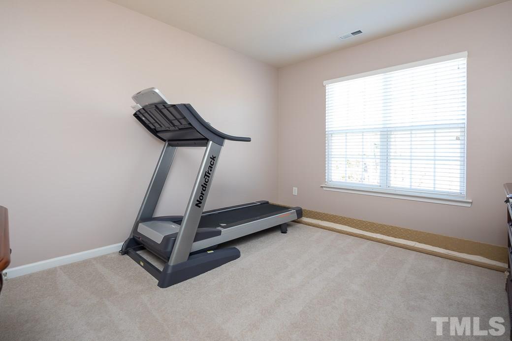 3315 Colorcott Street Raleigh, NC 27614 - Photo 12 of 21 a room with gym equipment with windows