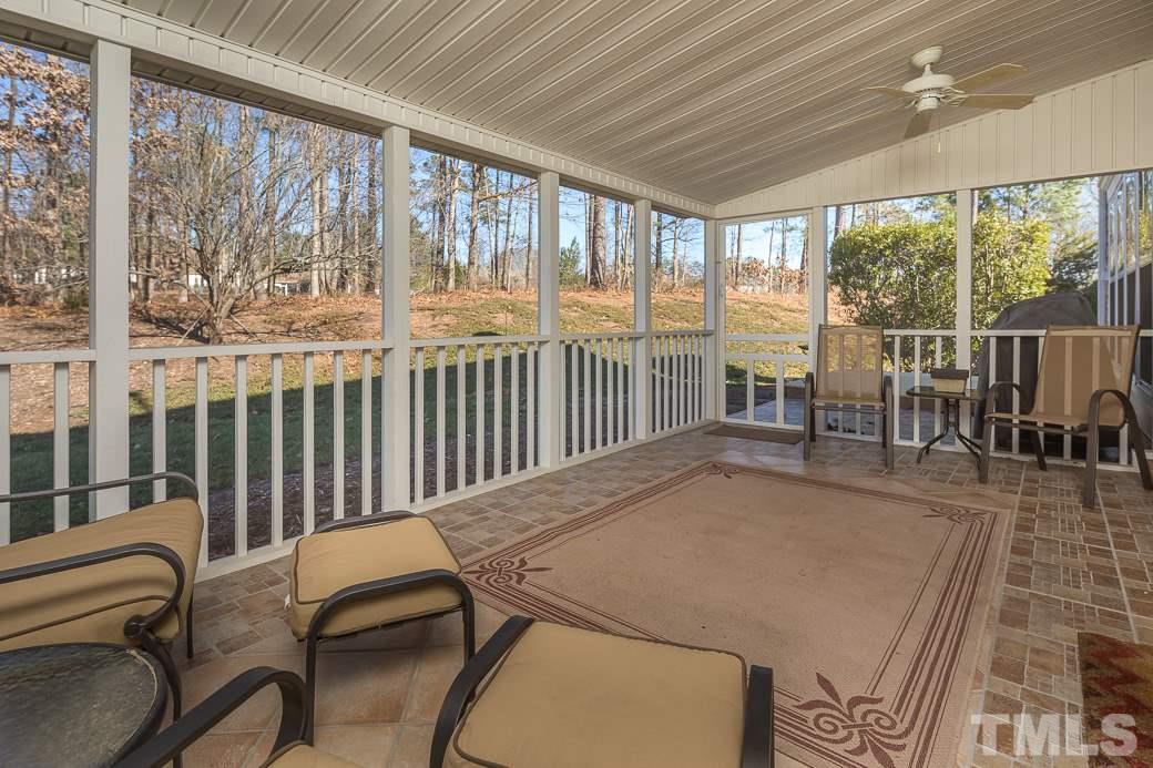 3315 Colorcott Street Raleigh, NC 27614 - Photo 16 of 21 a view of a dining room with furniture large windows and wooden floor