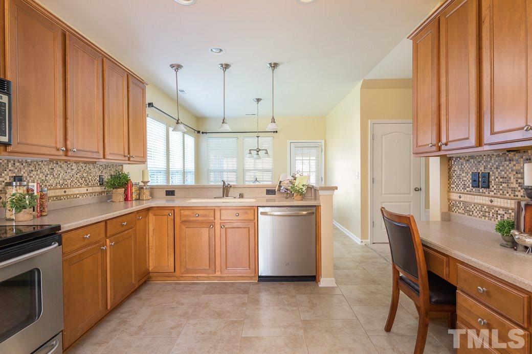 3315 Colorcott Street Raleigh, NC 27614 - Photo 4 of 21 a kitchen with a sink and cabinets