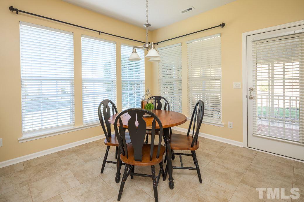 3315 Colorcott Street Raleigh, NC 27614 - Photo 5 of 21 a view of a dining room with furniture and windows
