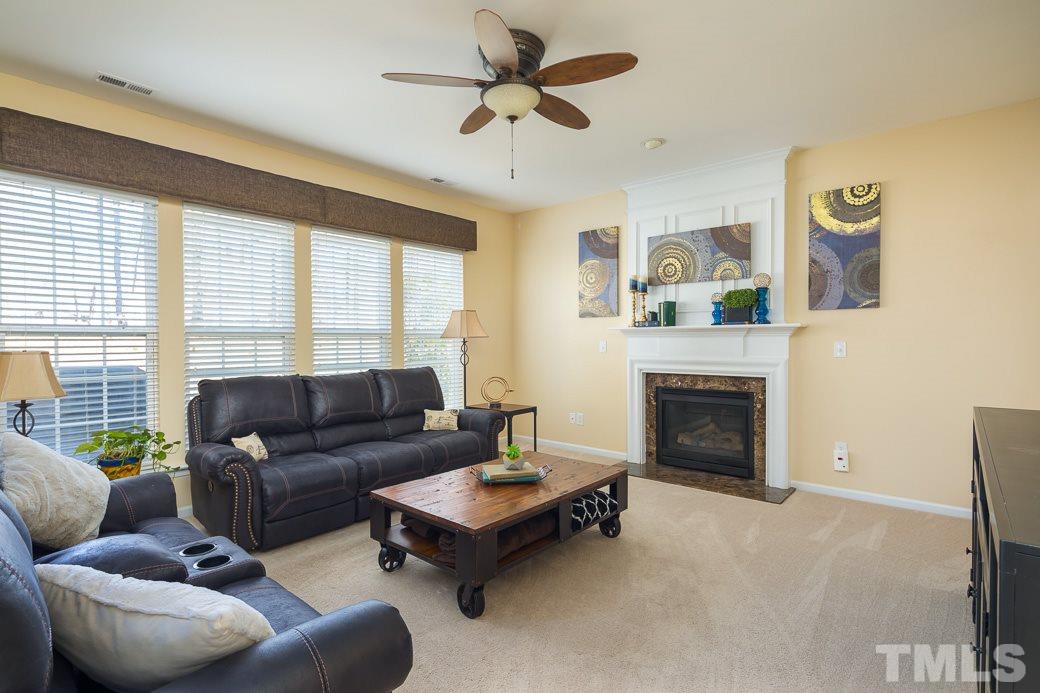 3315 Colorcott Street Raleigh, NC 27614 - Photo 6 of 21 a living room with furniture and a fireplace
