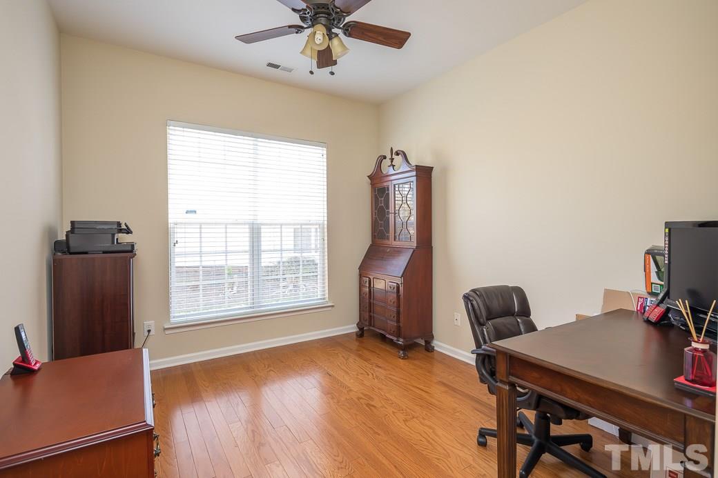 3315 Colorcott Street Raleigh, NC 27614 - Photo 8 of 21 a view of a workspace with furniture and a window