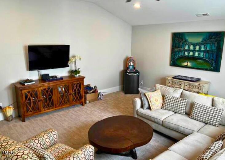 3015 Freeman Farm Way Rolesville, NC 27571 - Photo 25 of 50 a living room with furniture and a flat screen tv