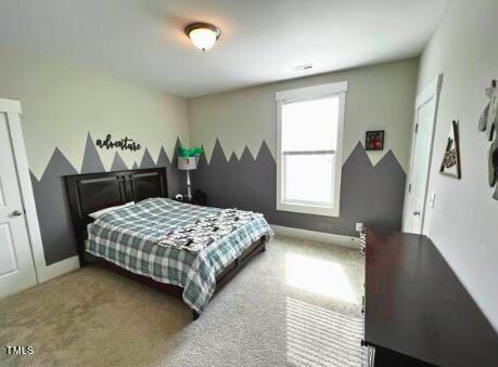 3015 Freeman Farm Way Rolesville, NC 27571 - Photo 34 of 50 a bedroom with a bed and a dresser