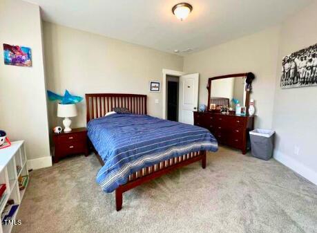 3015 Freeman Farm Way Rolesville, NC 27571 - Photo 36 of 50 a bedroom with a bed and dresser