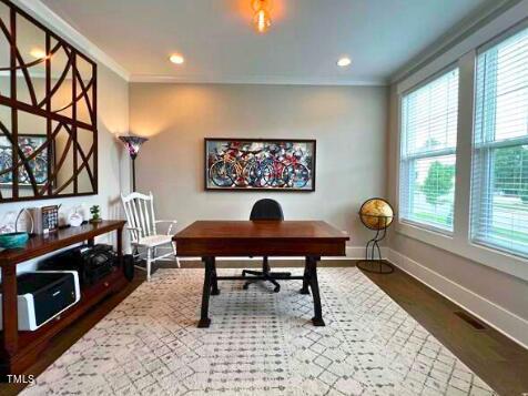 3015 Freeman Farm Way Rolesville, NC 27571 - Photo 7 of 50 a living room with furniture a rug and a window