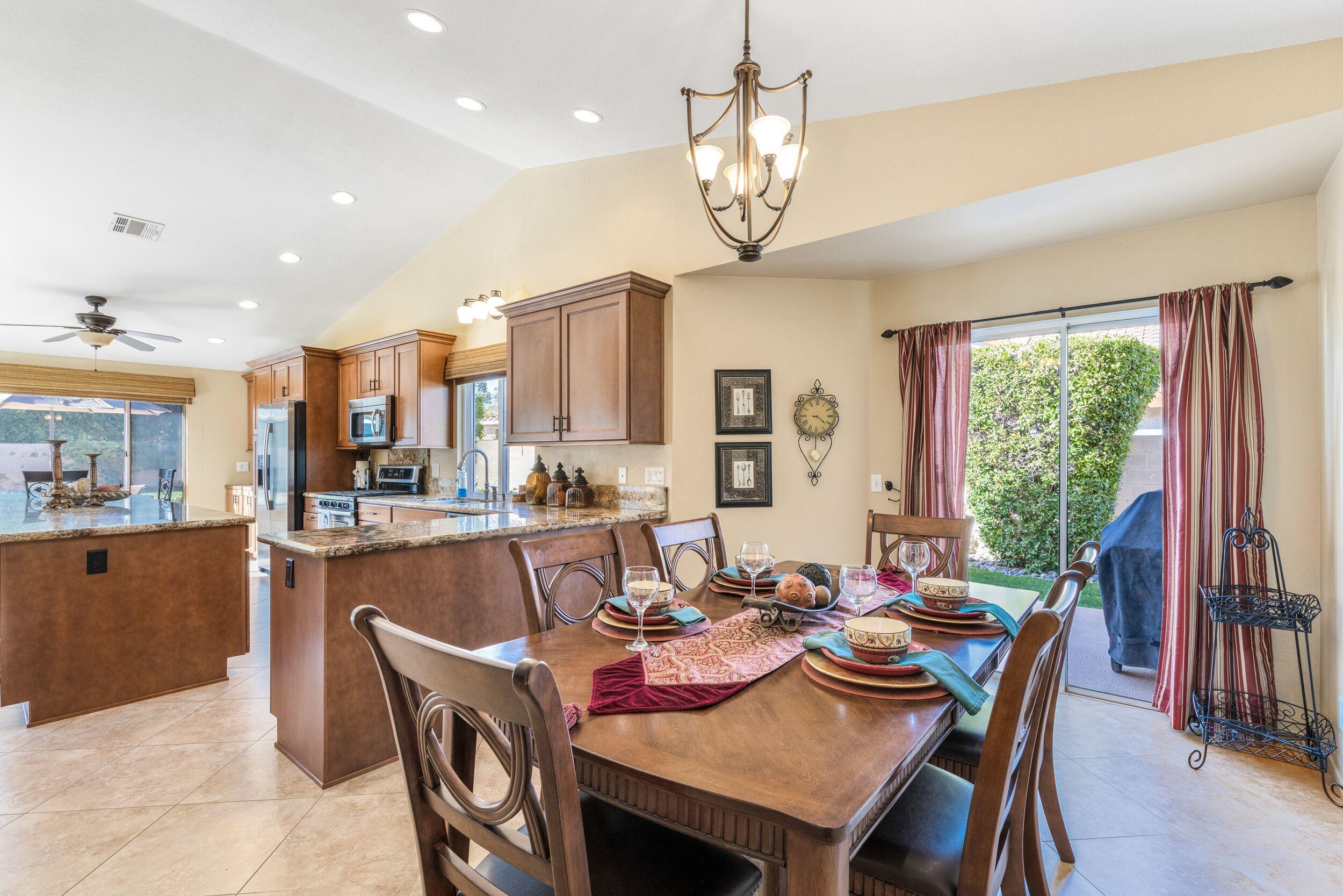 39795 Regency Way Palm Desert, CA 92211 - Photo 15 of 39 a view of a dining room and livingroom view