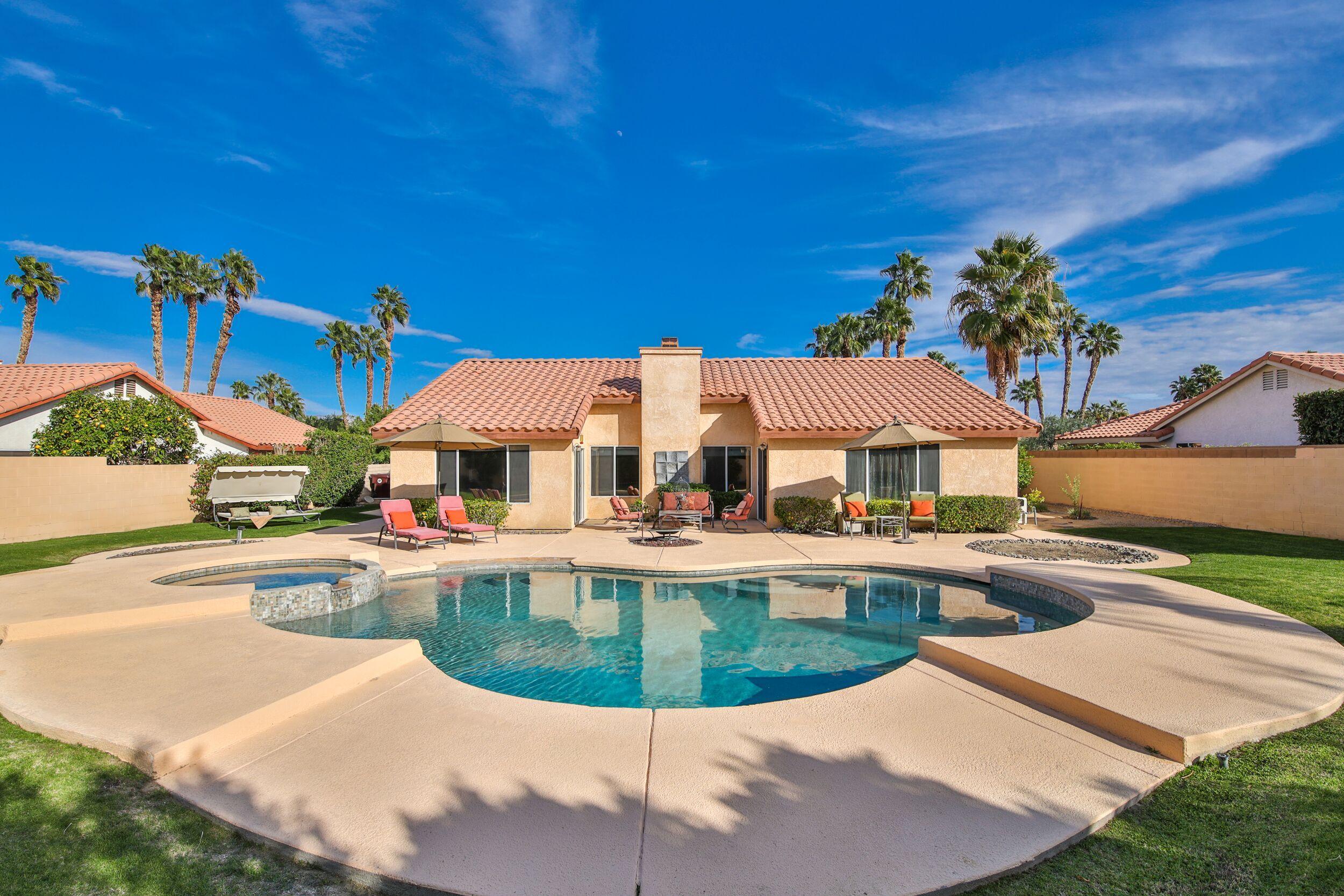 39795 Regency Way Palm Desert, CA 92211 - Photo 21 of 39 a view of a house with swimming pool