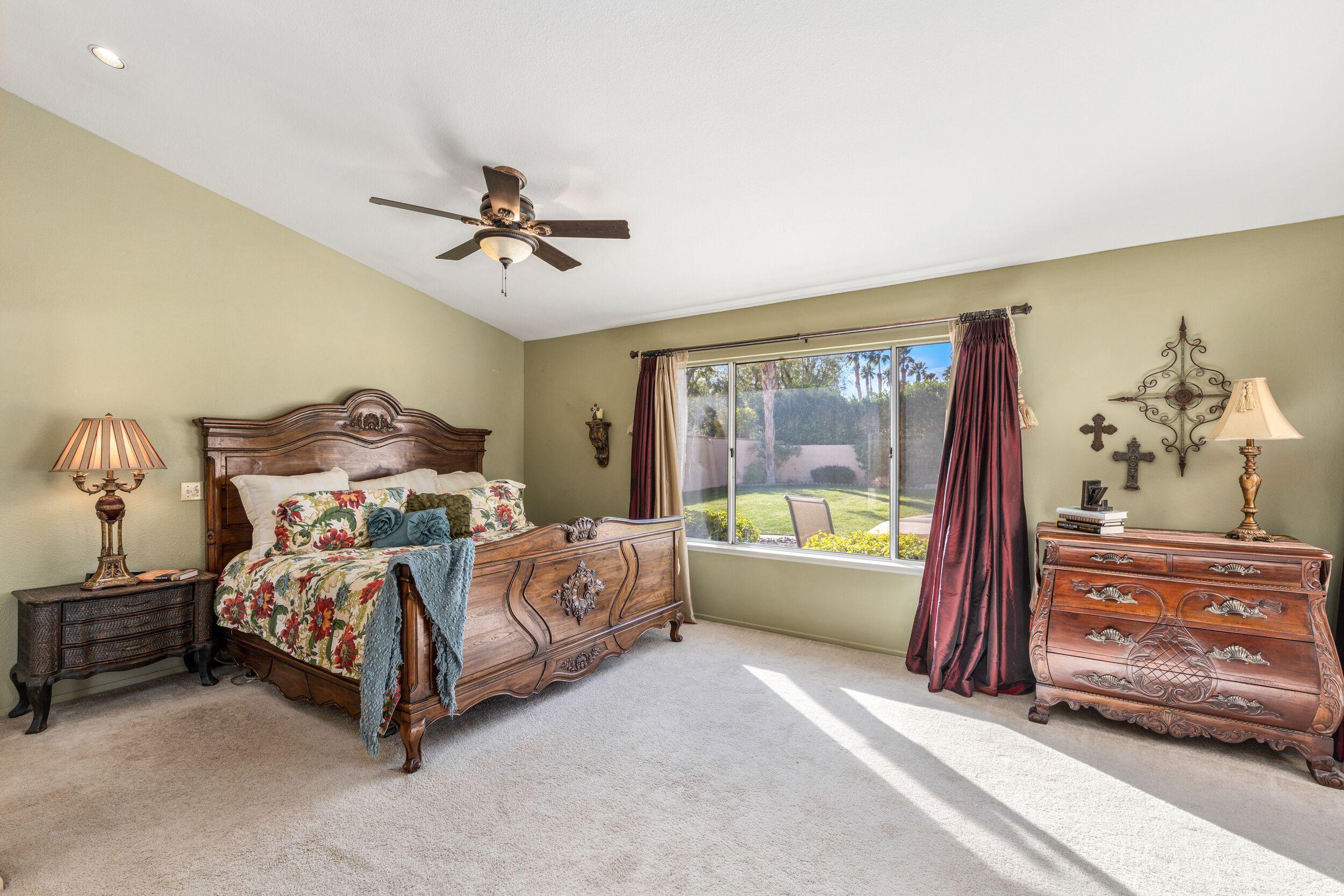 39795 Regency Way Palm Desert, CA 92211 - Photo 22 of 39 a bed room with a bed and a balcony