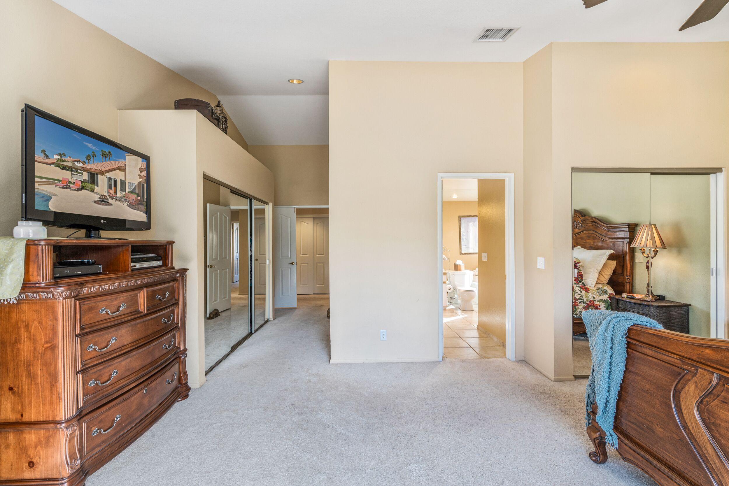 39795 Regency Way Palm Desert, CA 92211 - Photo 25 of 39 a view of a hallway with workspace and a window
